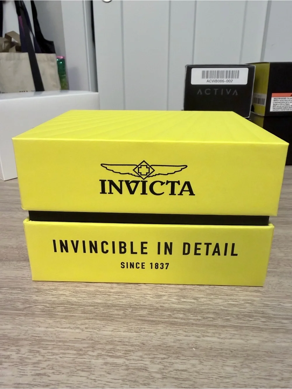 Invicta Pro Diver series stainless steel watch featuring a striking red dial